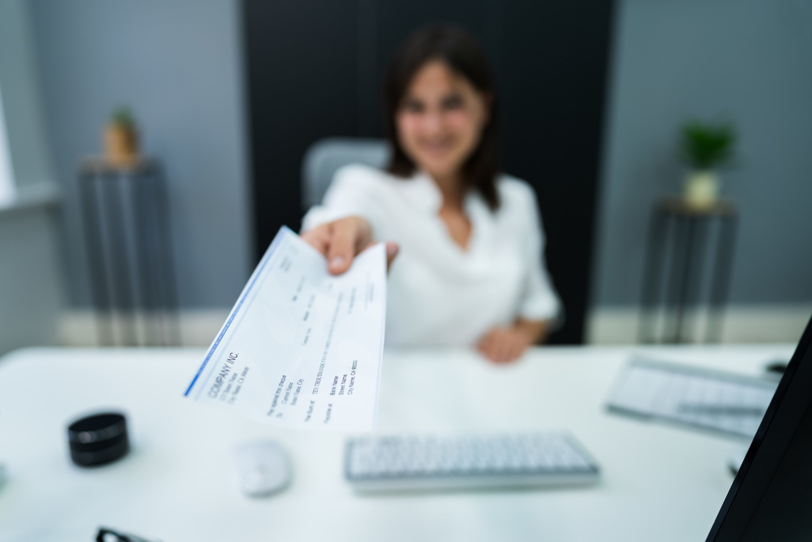 Employee Payroll Cheque. Handing